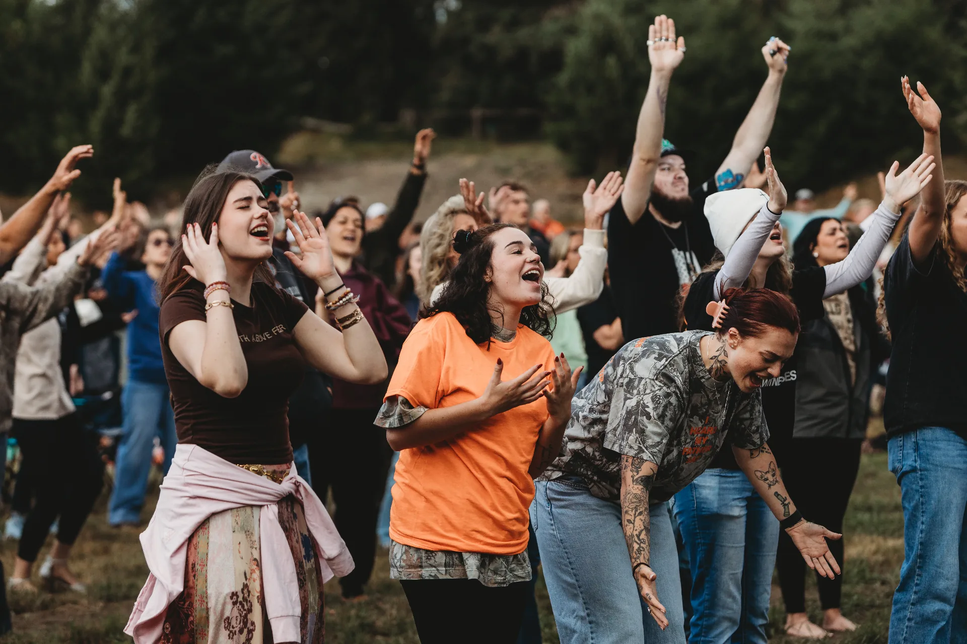 A wide gathering worshipping together at Revival at the Farm